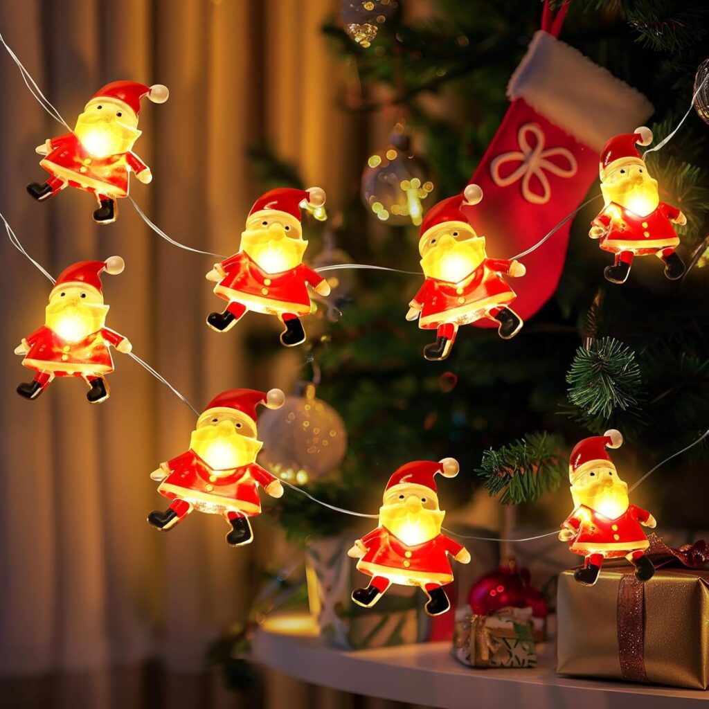 Glowing Santa Claus string lights beside a Christmas tree
