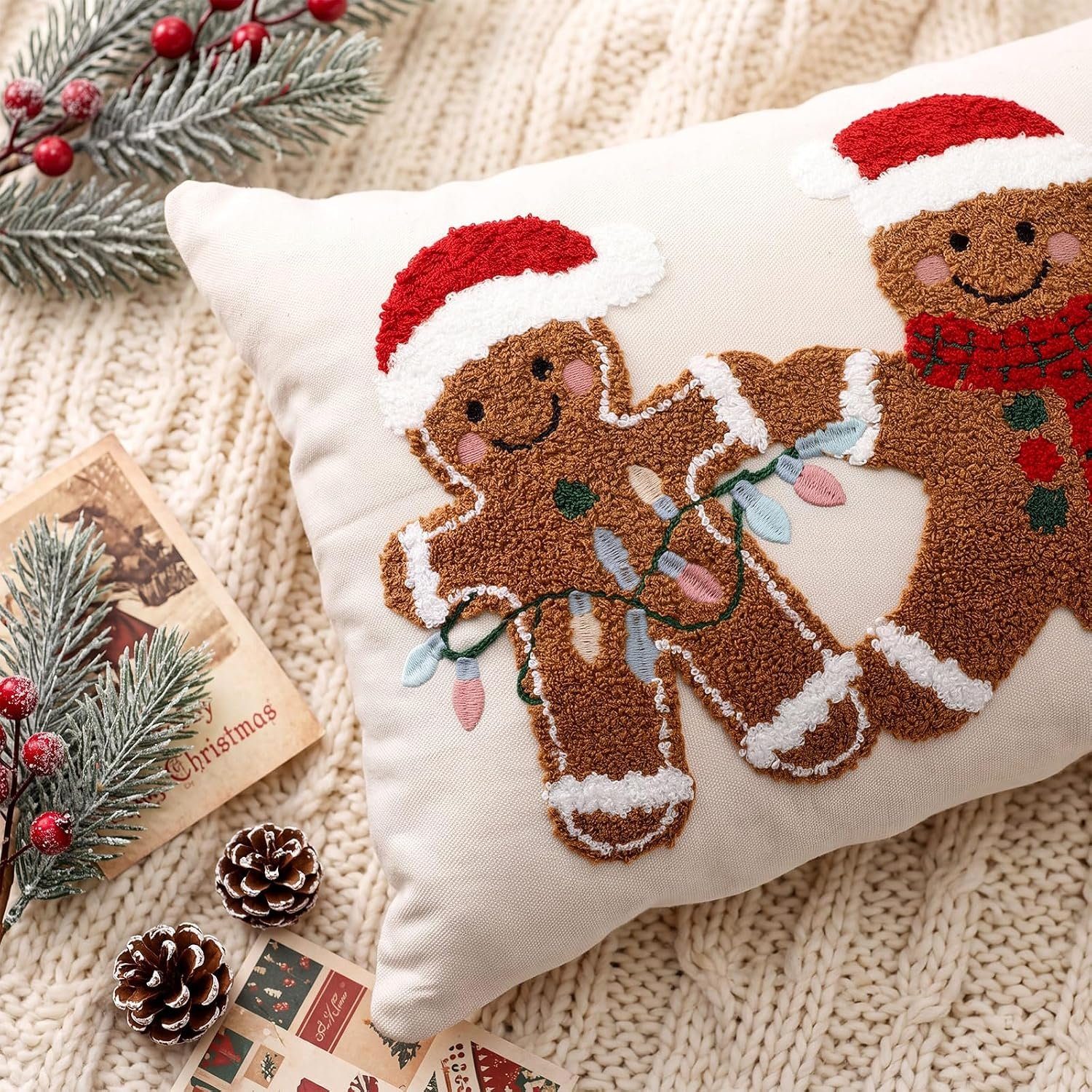 Close-up of embroidered gingerbread men on a Christmas pillow cover
